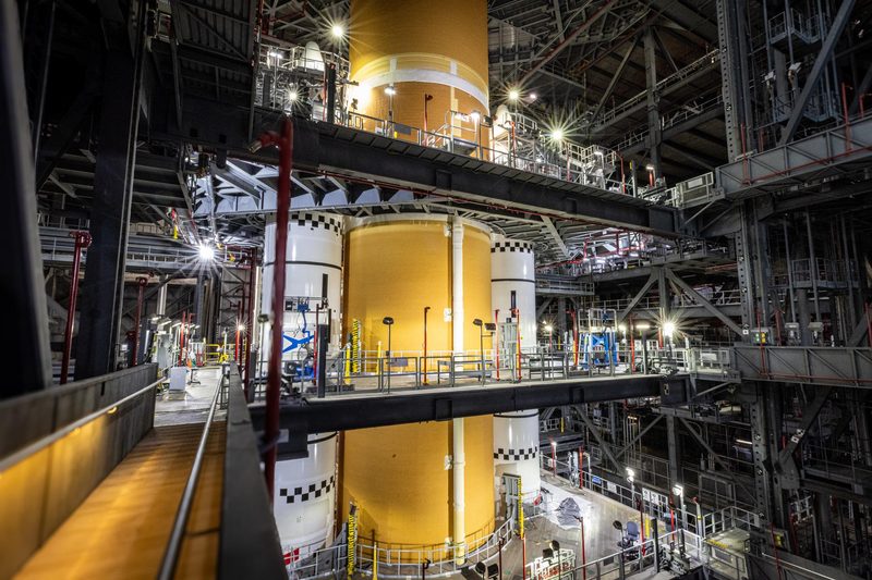 The Artemis III SLS core stage being joined to its solid rocket boosters inside NASA's Vehicle Assembly Building